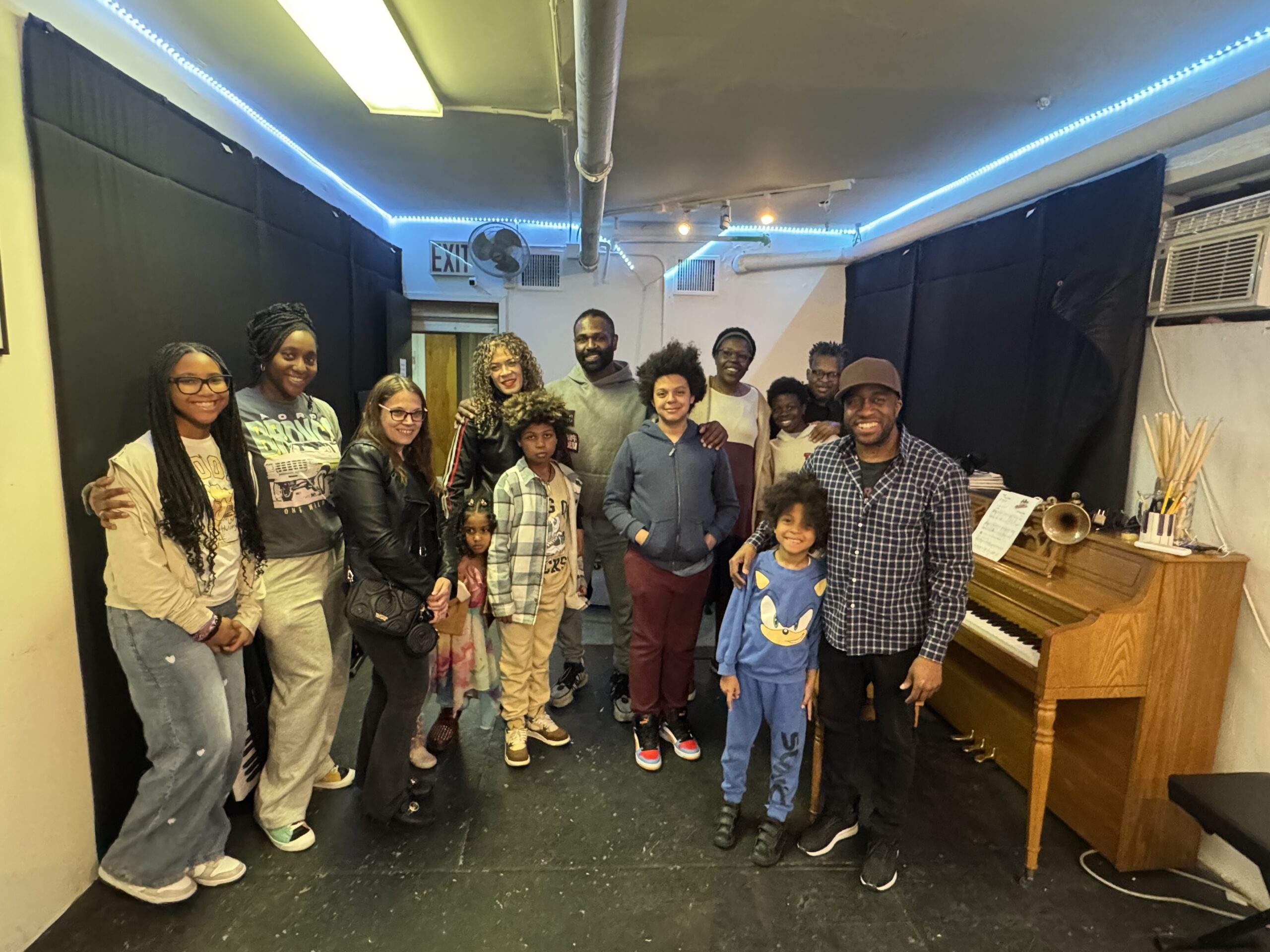 Workshop participants and families gathered at Harlem Music Studios