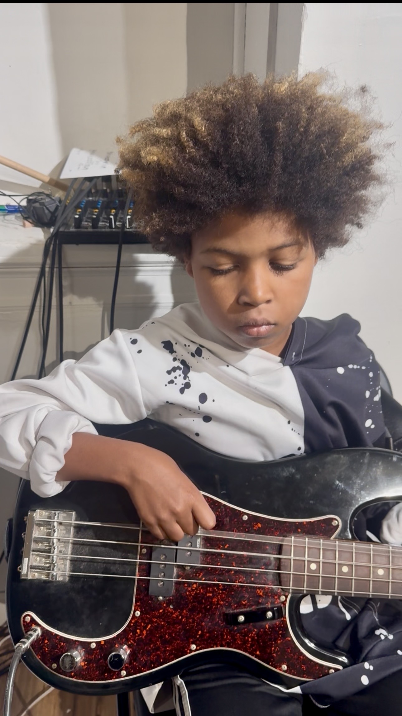 Workshop participant playing bass