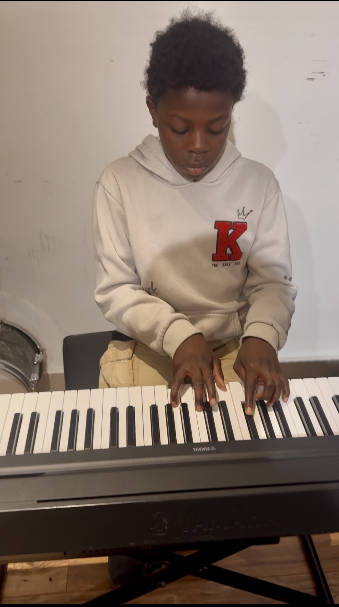 Workshop participant playing keyboard
